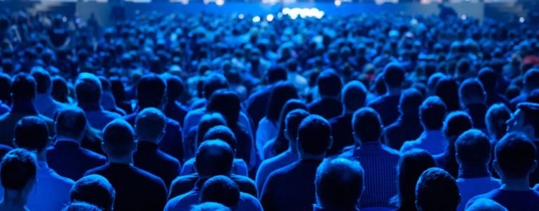 Audience listens to the lecturer at the conference (Hypothetically for Lesbufy)