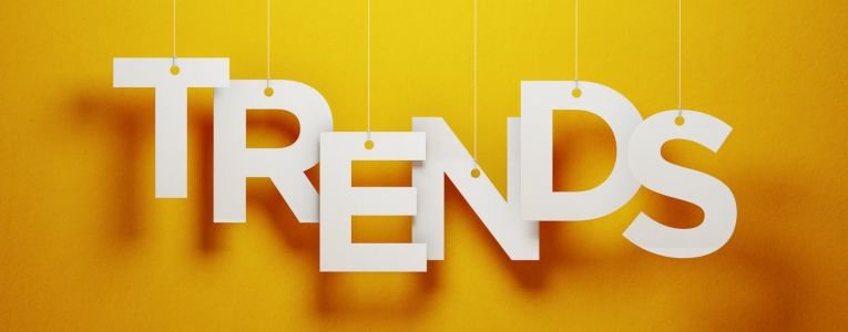 Trends Concept - White Trends Text With Strings Over Yellow Background