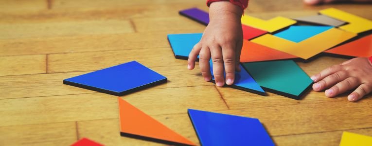 little girl playing with puzzle, early education